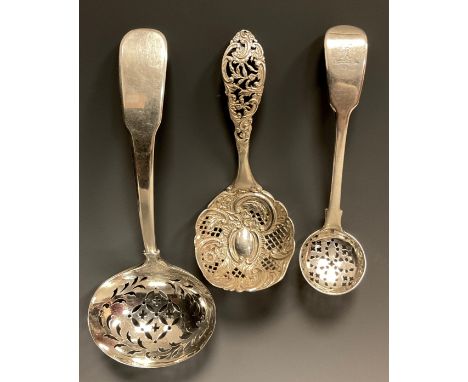 A George III silver oval bowl straining spoon, Thomas James, London 1808;  spice or sugar straining ladle, William Chawner, L