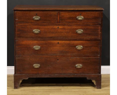 A George III oak chest, rectangular top with moulded edge above two short and three long drawers, brass swing handles, bracke