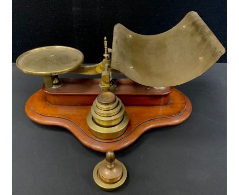 A set of W. White and Son of Auchtermuchty Victorian balance scales, dished platform, mahogany plinth with tower of eight gra