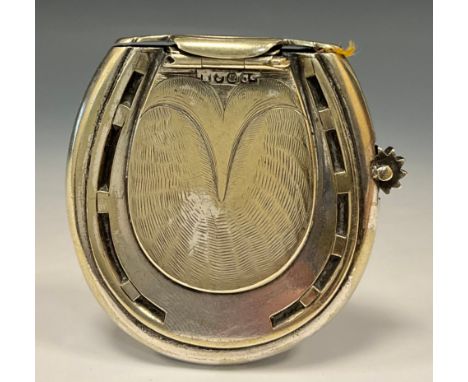 A novelty silver plated combination vesta case pocket lighter, as a Horseshoe, 5.4cm high 