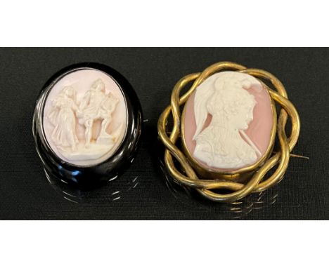 A Victorian pink and white shell cameo brooch, bust portrait to dexter, wearing a plumed helm, long flowing hair, jewelled ne