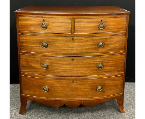 A George III mahogany bow-front cheats of two short, over three graduated long drawers, shaped apron, splayed bracket feet, 1