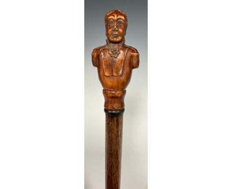 A Battle of Trafalgar carved handled walking stick, as a bust of Lord Nelson, inscribed Trafalgar 1805, 97.7cm long 