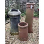 Three assorted terracotta chimney pots, largest height 90cm. Condition - weathered, some small chips