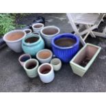 A collection of assorted glazed pottery garden planters including Heritage Garden Pottery, largest