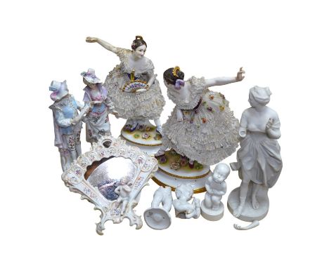 A collection of Continental porcelain ceramic figurines, including a pair of lace examples, dancing ladies and an easel mirro
