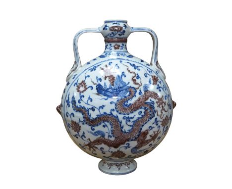 A Chinese blue and white with iron red two handled moon flask, 29cm high. Condition - good