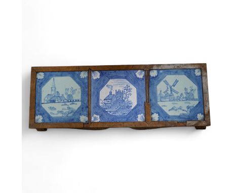 A 19th century Delft tile inset walnut stand, 49cm wide. Condition - poor Tiles 14.6cm square.  Tiles with some surface scrat
