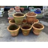 A matching set of eight terracotta garden pots, height 33cm, diameter 38cm. Condition - used and