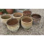 A set of four Minos Italian style terracotta planters, height 35cm, depth 40cm, and a pair of