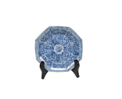 A Chinese blue and white octagonal saucer dish, Kangxi period, with stand, 9.5cm in diameter. Condition - good