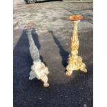 A pair of white painted cast iron pricket candlesticks, height 67cm. Condition - weathered
