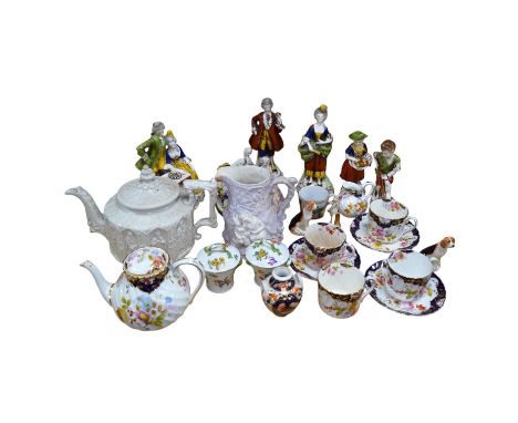 A quantity of 19th and early 20th century ceramics including two chess playing groups, four further Continental figures, a co