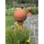 A large pair of Victorian terracotta ball finials, height 64cm, diameter 46cm. Condition -weathered,