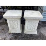 A pair of Sparta Statues reconstituted stone plinths, with scrolling foliate decoration, width 36cm,