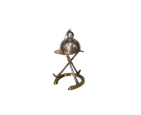 A late Victorian 'equestrian theme' silver plated novelty club lighter, modelled with a riding hat, crops and a horseshoe, 11