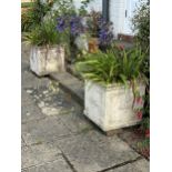 A pair of square reconstituted stone planters, height 50cm, width 50cm. planting removed,