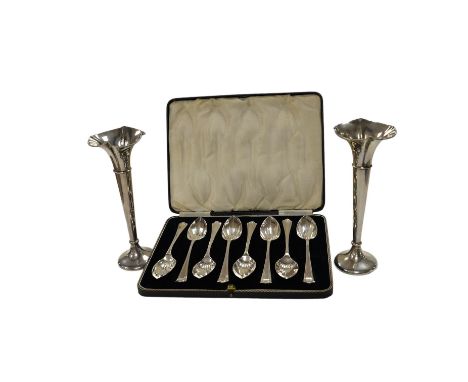 A cased set of eight George V silver grapefruit spoons, Sheffield, 1933 and a pair of silver spill vases, 17.5cm. Condition -