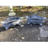 A set of four cast iron planters, width 36cm, and a pair of more ornate planters, width 48cm.