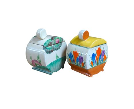 Two Clarice Cliff drum shaped preserve pots and covers, one in Crocus pattern and the other in Viscaria pattern. Condition - 