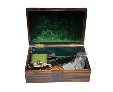 A group of various knives in a coromandel box with various other collectibles including loose stones and a Georgian snuff box