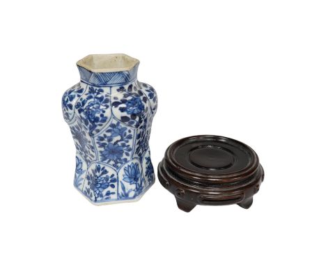 A Chinese blue and white hexagonal jar, Kangxi period and stand, 10cm high. Condition -small firing crack to inside edge of f