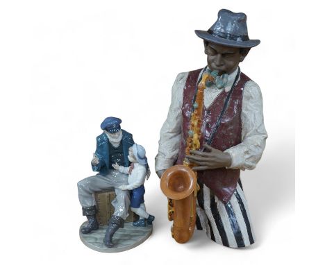 A Lladro figure ‘Playing the Blues’, 63cm high and a ‘Tall Yarn’ figure group of a fisherman and a boy. Condition - fisherman
