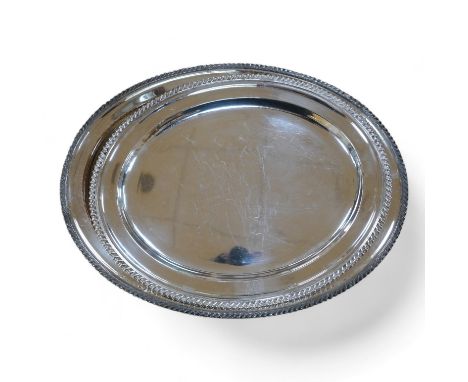Two 19th century Old Sheffield plate oval meat plates, with gadrooned borders, largest 58.2cm. Condition -  plate worn and sc