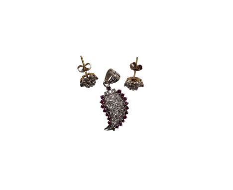 A white metal, diamond and ruby set pendant, 26mm and a pair of 9ct and diamond cluster set ear studs, gross weight 6.1 grams