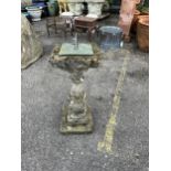 A reconstituted stone sun dial, height 64cm. Condition - weathered, otherwise good