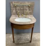 A marbled topped mahogany wash basin with John Bolding & Sons Erno ceramic basin and brass metal