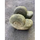 A pair of reconstituted stone 'ammonite' garden ornaments, length 47cm, height 40cm. Condition -