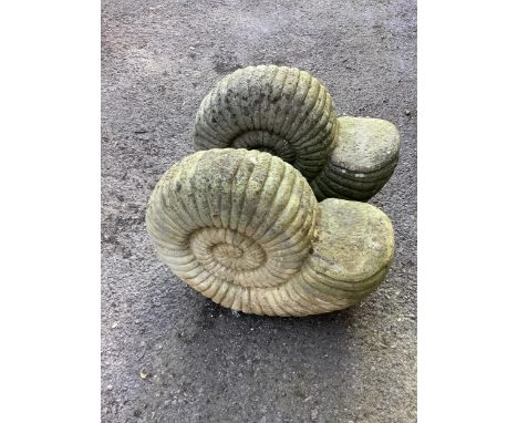 A pair of reconstituted stone 'ammonite' garden ornaments, length 47cm, height 40cm. Condition - fair