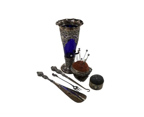 A small group of assorted silver items including mounted blue glass spill vase, 17.2cm, mounted shoe horn and button hook and