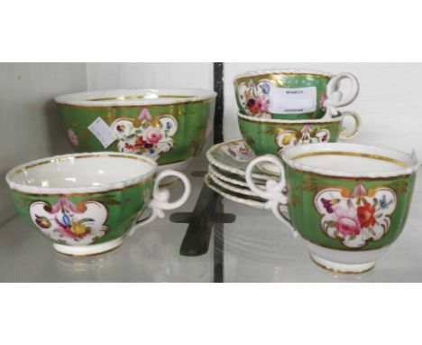 A quantity of early 19th Century Davenport teaware with decorative floral panel on green ground, comprising three cups and sa