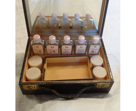 A vintage Elizabeth Arden Ardena vanity set in faux crocodile skin case