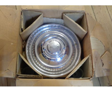 A boxed set of four vintage Ace-Mercury hub caps - never used