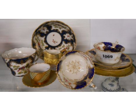 A Coalport demitasse cup with saucer with jewelled decoration, similar jug and saucer, two Coalport cups with saucers, and a 
