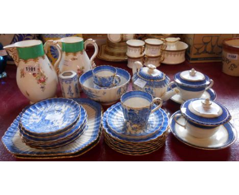 A Copeland Spode Willow pattern part tea set, two Booths soup bowls, covers and stands, and two graduated bone china mask hea