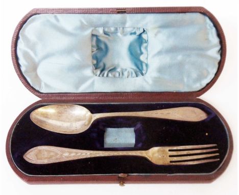 A Victorian leather clad cased part christening set with ornate spoon and fork - napkin ring missing