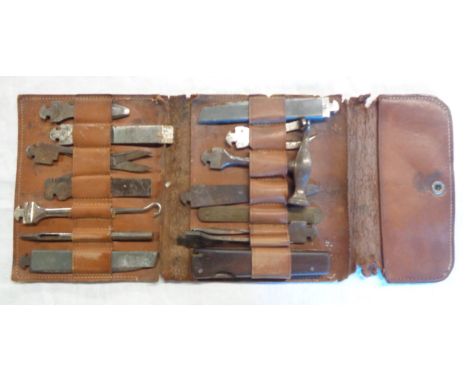 A 1920`s-30`s German tool adaptor kit, in leather wrap wallet