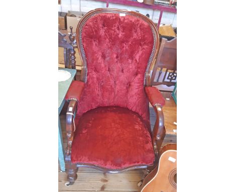 A Victorian mahogany part show frame spoon back drawing room armchair with button back crushed velour upholstery, set turned 