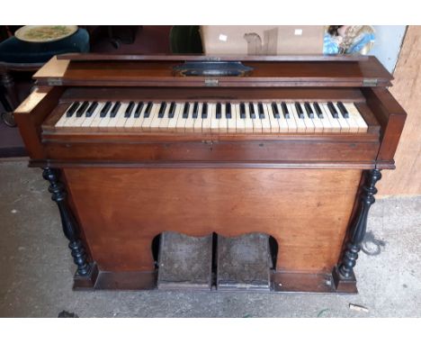 A late 19th Century E. Francis of Carno (Montgomeryshire) stained mixed wood cased harmonium with flanking iron carrying hand