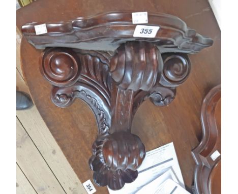A 17" far eastern hardwood wall bracket in the antique style with scroll supports