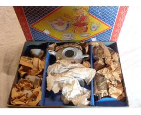 A vintage child's china tea set in original box