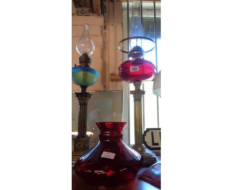 A tall column table oil lamp with ruby glass reservoir and shade (shade a/f)