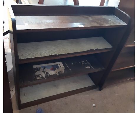 A 20th Century stained oak three shelf bookcase - glass sliding doors missing