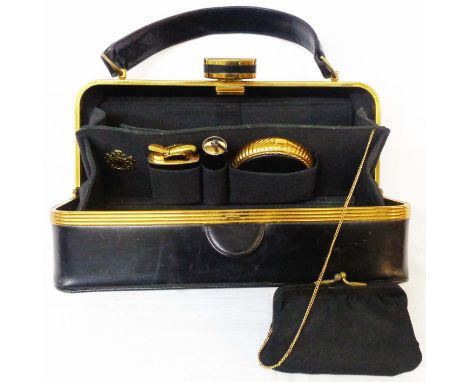 A vintage ladies Evans Elegance vanity handbag with fitted purse, lipstick holder, compact, mirror, comb, and lighter