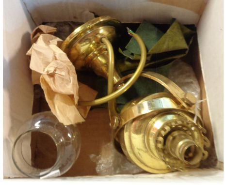 A brass wall mounted gimbal lamp in the antique style