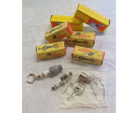 Four vintage boxed Bosch spark plug pattern lighters and two similar LED torch keyrings